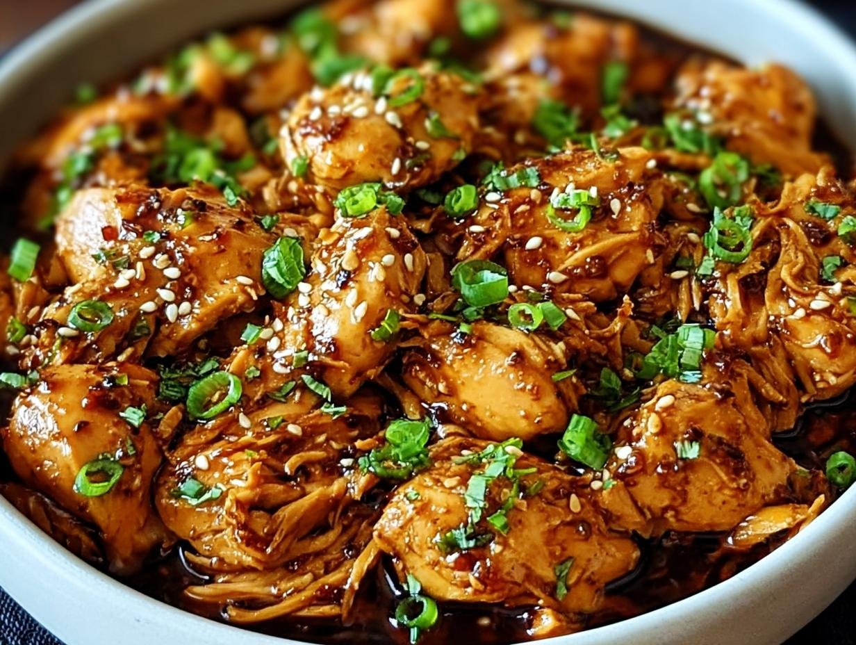 Sweet Garlic Chicken Crockpot dish with glaze and green onions