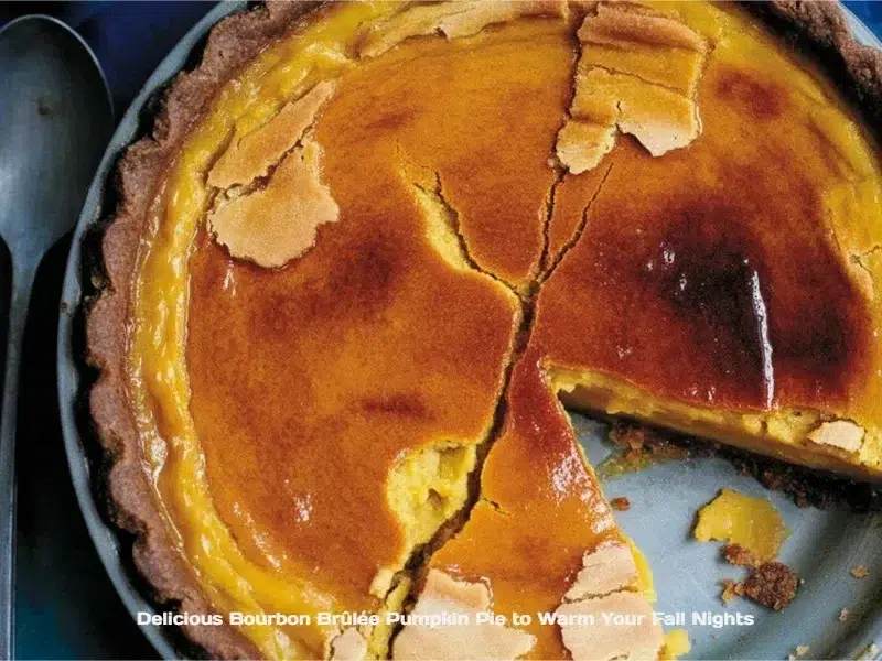 A slice of Bourbon Brûlée Pumpkin Pie with caramelized topping and autumn spices.