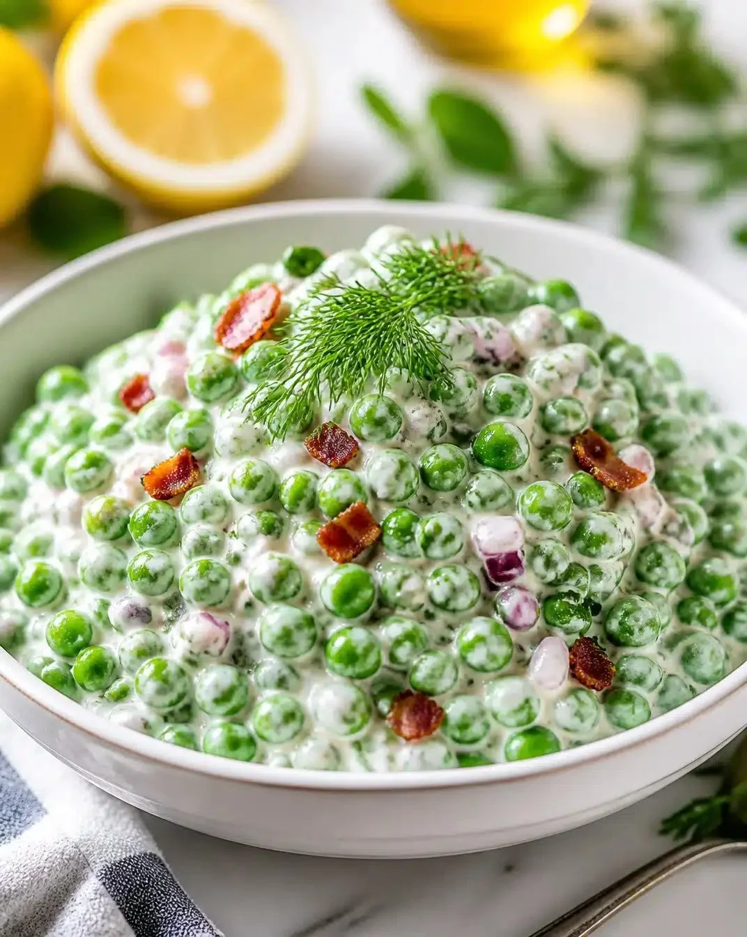 Creamy Greek yogurt green pea salad with fresh ingredients and a vibrant appearance.
