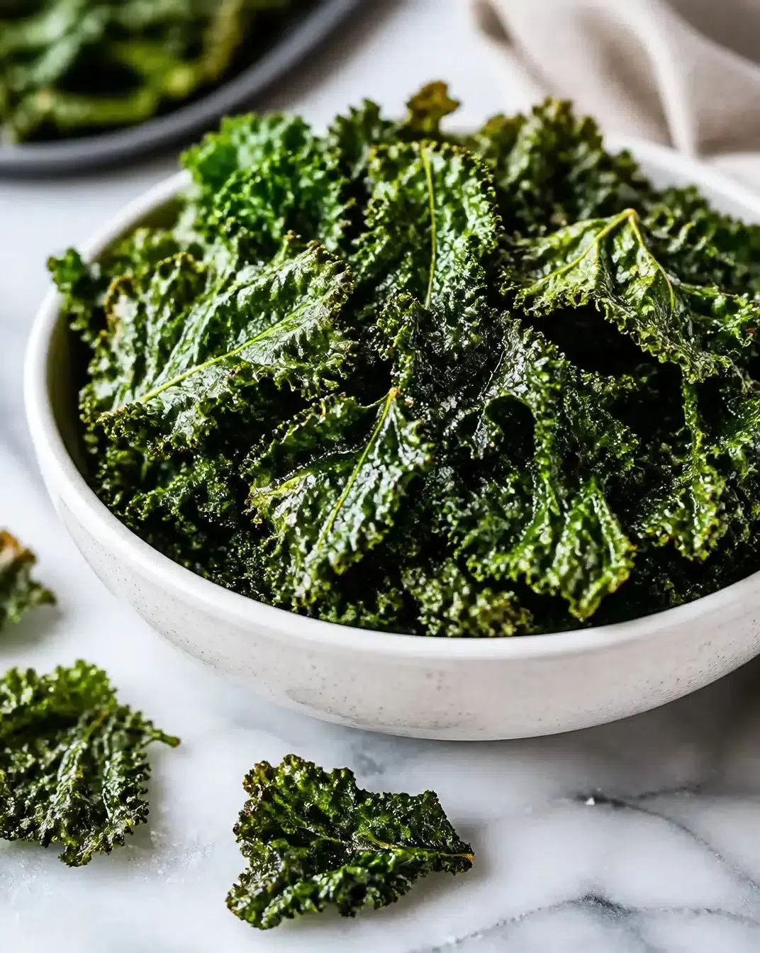 Crispy air fryer kale chips ready to be served as a healthy snack